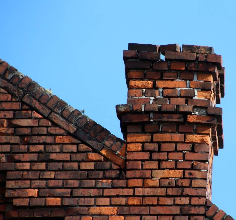 Signs Your Little Elm Home Needs a Chimney Inspection Damaged chimney on an Little Elm home showing cracks and missing mortar